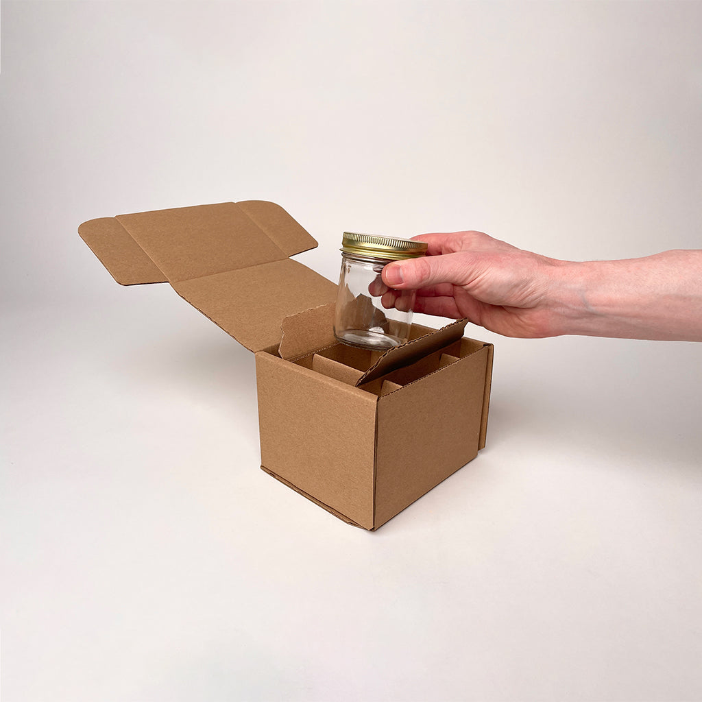 https://flushpackaging.com/cdn/shop/files/8-oz-Straight-Sided-Jelly-Jar-Shipping-Box-unboxing-4_1200x.jpg?v=1692409084