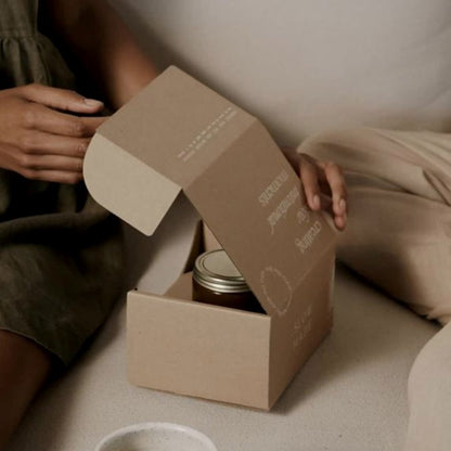 Candle from Slow Made packed with the 9 oz Straight Sided Glass Jar Shipping Box for candles available from Flush Packaging