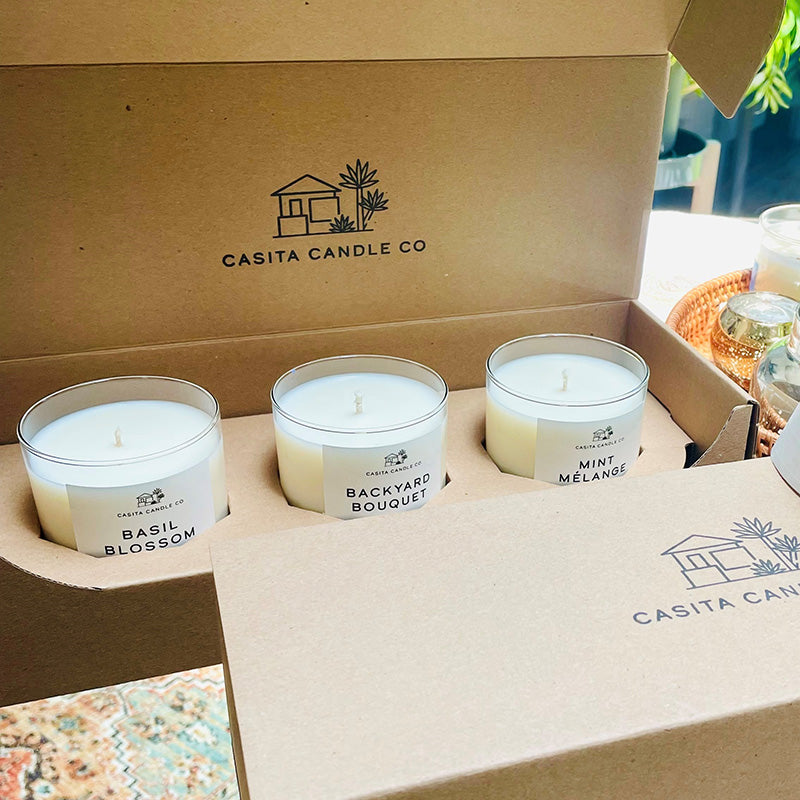 Three candles from Casita Candle Co made with the CandleScience Straight Sided Tumbler and packed with the Straight Sided Tumbler 3-Pack Shipping Box from Flush Packaging.