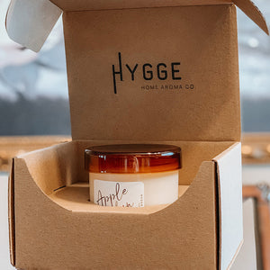Hygge Home Aroma Co Candle packaged with the Straight Sided Tumbler Shipping Box available for purchase from Flush Packaging