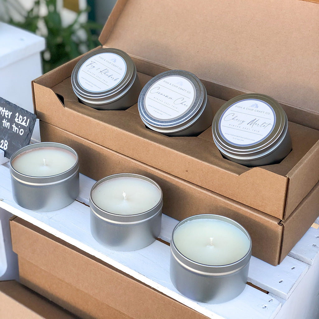 Fish and Chip Craft Co. Candles packed inside the Flush Packaging 8 oz Candle Tin 3-Pack Shipping Box